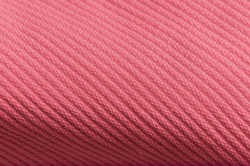 Closeup of pink corduroy cloth as patterned textured background