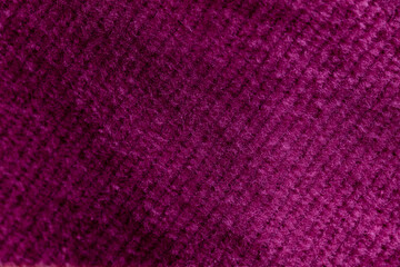 Closeup of pink corduroy cloth as patterned textured background