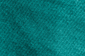 Closeup of green corduroy cloth as patterned textured background
