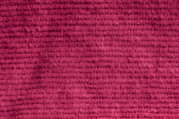 Closeup of pink corduroy cloth as patterned textured background
