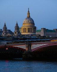 Dome of St Paul's Cathedral in evening above Blackfriars Bridge and River Thames