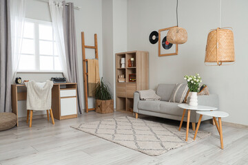 Interior of author's office with vintage typewriter on table and sofa