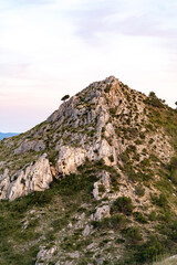 Sunset over a hill in Alcudia town in Mallorca Spain on a summer day with pastel colors