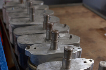 Closeup view of shoe lasts at factory workshop.