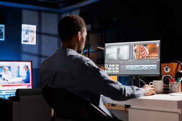 Video maker producing montage with artistic software, color adjustment, and special effects....