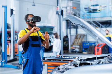 Professional in auto repair shop using virtual reality to visualize car distributor in order to fix it. Hardworking garage worker wearing futuristic vr headset while mending faulty vehicle