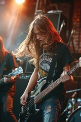 Obraz premium A young rock band is performing hard on the stage