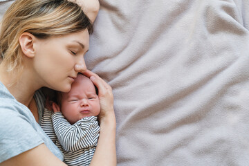 Mother and baby at home. Happy maternity and family.
