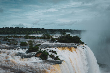 Iguazu falls waterfalls majestic natural wonder panorama view water clouds sunny argentina brazil side