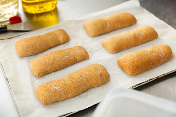 white bread in black baking box in bakery