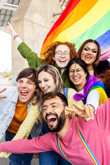 Happy gay group of young people celebrating gay pride day festival. LGBT community concept