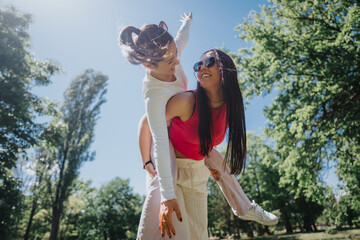 A vibrant depiction of happiness as a couple shares a playful piggyback ride in a sunlit park,...