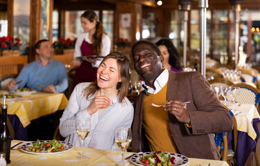 Portrait of a happy couple at a dinner in a restaurant