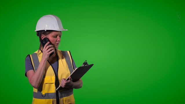 Female construction worker medium shot green screen