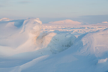 Winter arctic landscape. Ice hummocks on the frozen sea in the Arctic. View of snow and ice at...