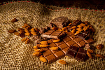 Horizontal photograph of variety of chocolates with almonds