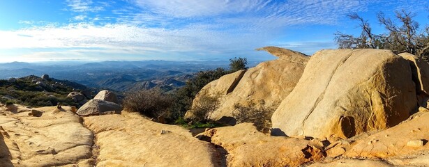 Famous Rock Formation Resembling Potato Chip at Poway Woodson Mountain Peak.  Scenic San Diego County California USA Panoramic Landscape.  Distant Pacific Ocean Coastline Horizon
