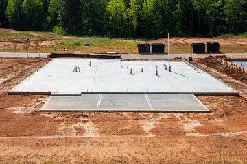 Slab-on-grade foundation with plumbing prep for residential house development