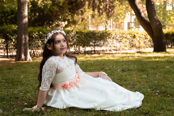 First Communion beautiful girl posing in white dress in a park 6.JPG