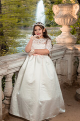 First Communion beautiful girl posing in white dress in a park 14.JPG