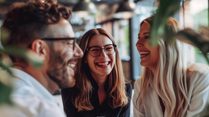 Obraz premium Group of People Laughing at Table