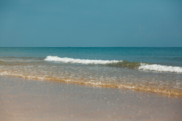 Little waves sliding toward the beach indicating persistence, peace and tranquility with copy space.