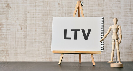 There is notebook with the word LTV. It is an abbreviation for Life Time Value as eye-catching...