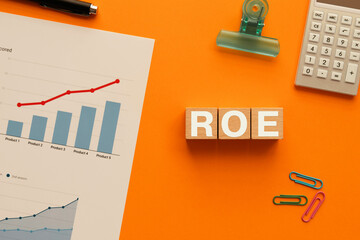 There is wood cube with the word ROE. It is an abbreviation for Return On Equity as eye-catching image.