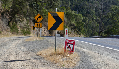 Slow vehicle pull in on the winding sections of the Princes Highway near Malacoota Victoria, on a total fire ban day