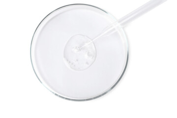 Glass pipette and petri dish with liquid on white background, top view