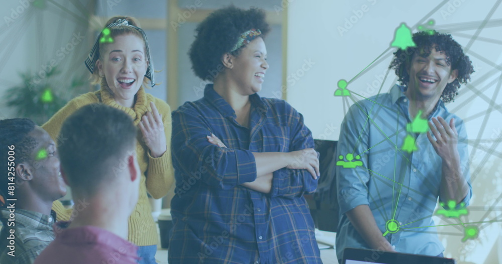 Aufkleber image of connected icons forming globes over diverse coworkers smiling while discussing reports