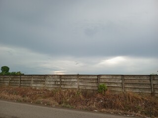 Fototapeta premium clouds over the fence
