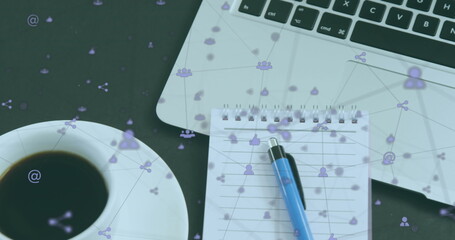 Image of icons connected with lines over notepad, pen, coffee cup and laptop on wooden table