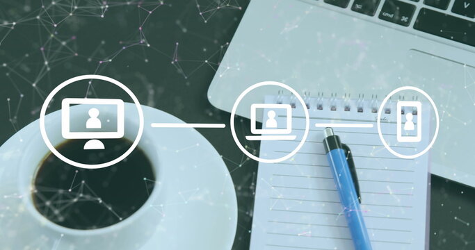 Image of flow chart of icon and connected dots over laptop, notepad and coffee cup on table