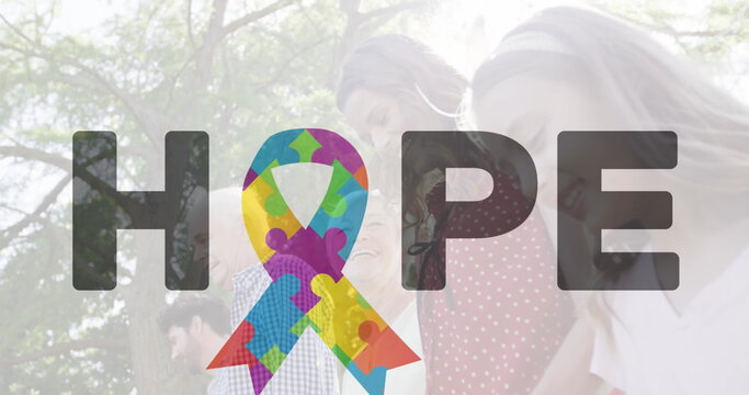 Image of colourful puzzle pieces forming ribbon and hope autism awareness month text over family - Powered by Adobe