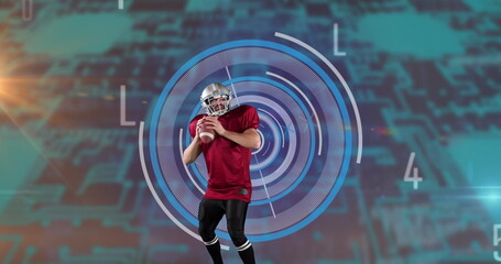 Caucasian male ruby player throwing the ball against round scanner and microprocessor connections