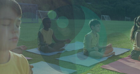 Image of ying yang icons over diverse children meditating