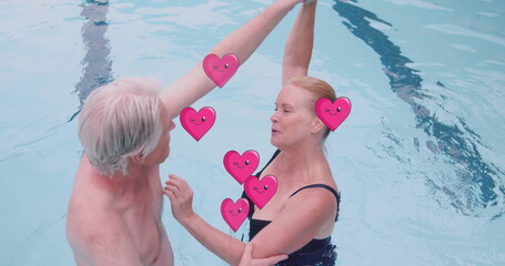 Image of heart icons over caucasian senior couple dancing in pool - Powered by Adobe