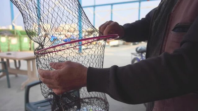 Fisherman Preparing Fish Cage Nets for Hunting in the Port Footage.