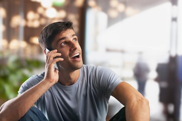 Happy smiling  business man holding smartphone