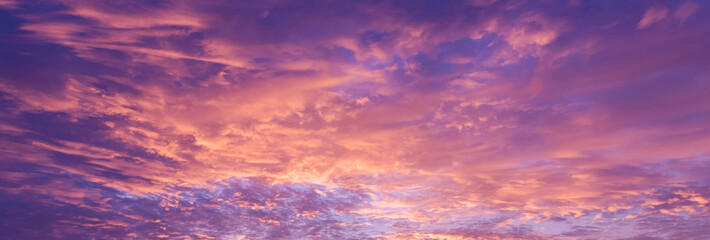 Banner purple sky sunrise dramatic beautiful landscape view. Dawn sky violet pink gold dusk time cloudscape with sunlight. Panorama Dramatic vibrant sunset scenic landscape nature with copy space