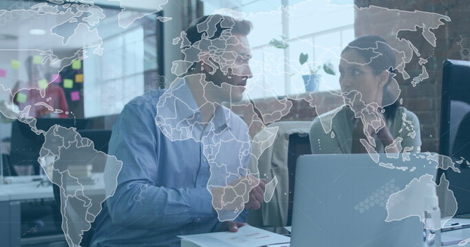 Image of data processing and world map over diverse man and woman discussing at office