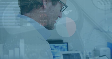 Image of data processing over caucasian male doctor discussing over reports at hospital