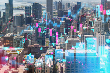 Aerial view of Chicago with futuristic hologram graphics overlaying the cityscape. Photograph with...