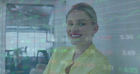 Image of stock market data processing against caucasian woman smiling at office - Powered by Adobe