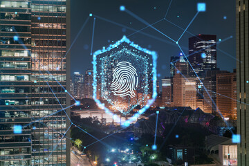 Night city skyline with a holographic fingerprint security concept overlay. Double exposure