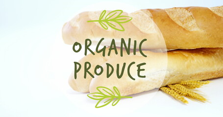 Image of organic produce text banner against close up of fresh bread and wheat ears