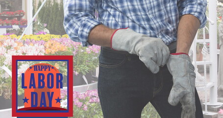 Image of labor day text over caucasian male worker with gloves