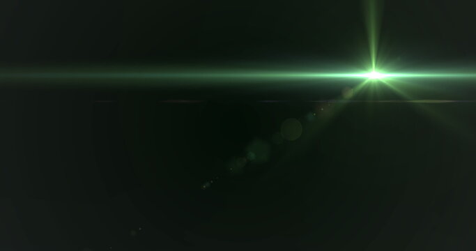Green light beam crossing dark background, creating lens flare - Powered by Adobe