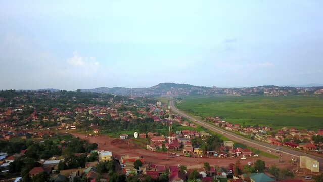Kampala- Entebbe Expressway Passing Through Neighbourhoods In Kampala, Uganda. aerial shot